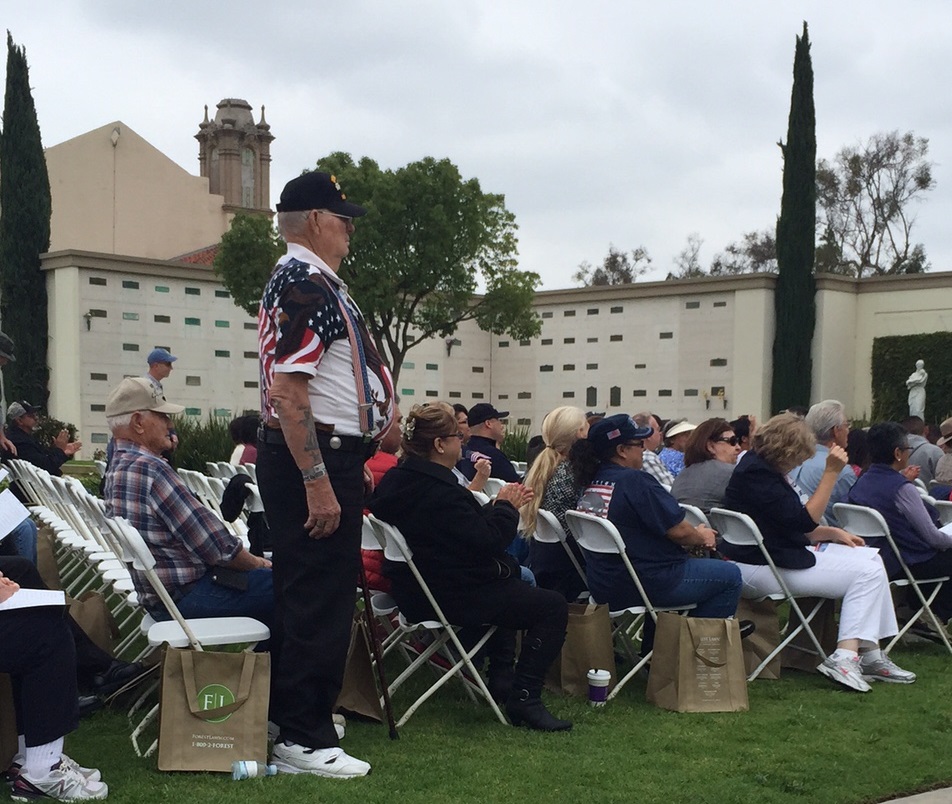 memorial day veteran standing in crowd