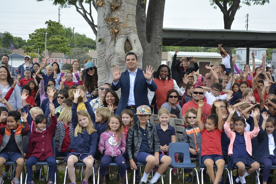 Garcia posing with students