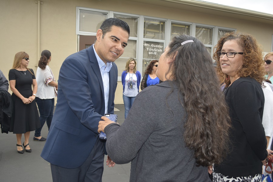 Garcia speaking to a parent