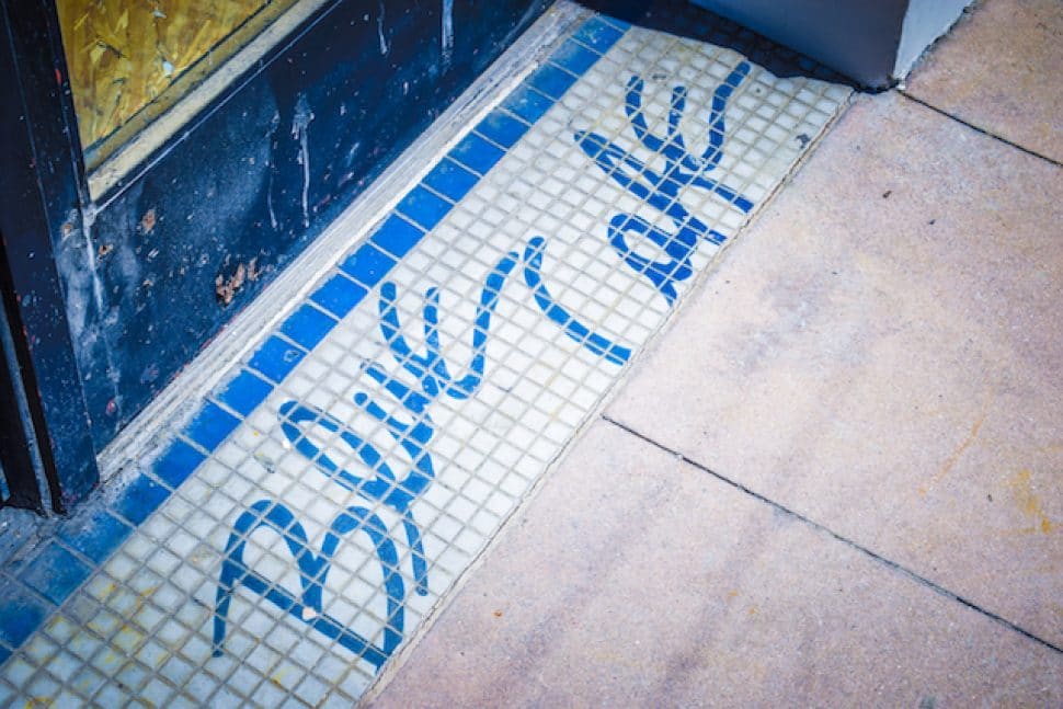The original mosaic for Blue Cafe's old entryway still sits at the foot of the building where the Ordinarie is being constructed in Downtown Long Beach. Photo by Brian Addison.