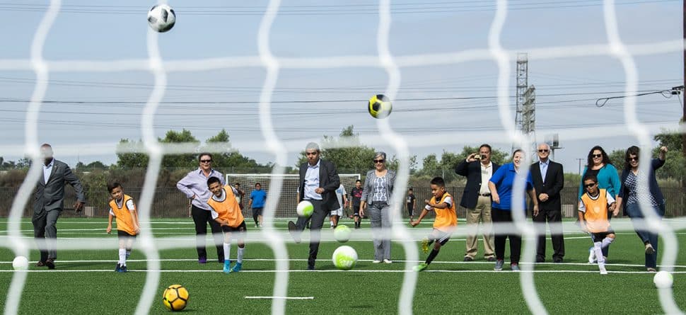 Mayor Robert Garcia and other officials kick soccer balls at the grand opening of David Molina Park in front in Long Beach August 28, 2018. Photo by Thomas R. Cordova.