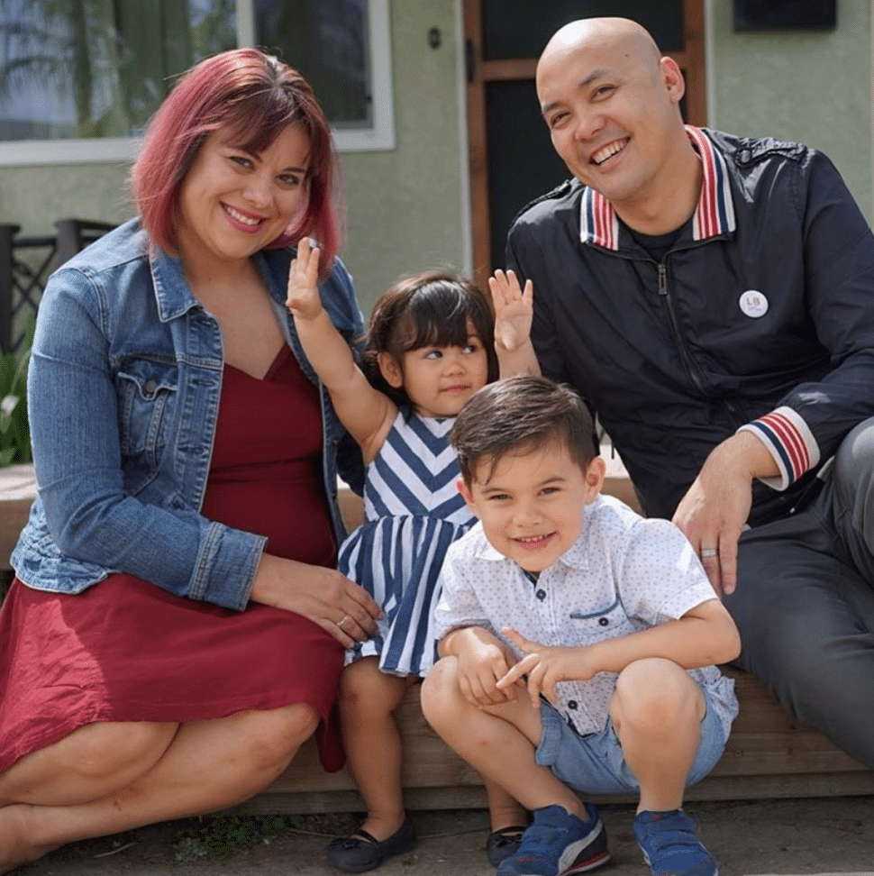Hazel Quimpo (left) joins her family for a quick photo on a stoop. Photo courtesy of LB Littles.
