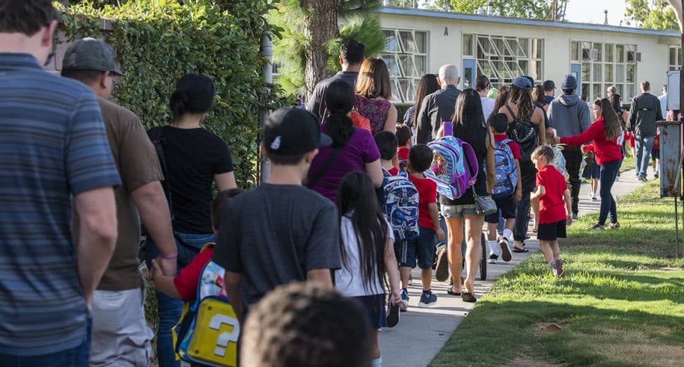 School kids and their parents make there the way to Gant Elementary School on the first day of school in Long Beach August 29, 2018. Photo by Thomas R Cordova/Safe Streets
