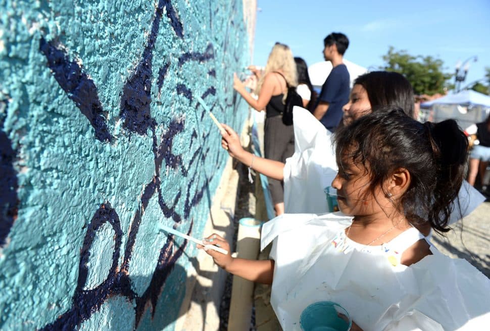 Vicktoria Recendez,4, paints a mural called " Celstia Butterfly " during Summer LuvinÕ Fest, at 5301 Long Beach Boulevard in North Long Beach Saturday. The free family friendly event featured multiple bands, as well as vendors, artists and the Long Beach local El Exclusivo food truck on site in Long Beach Saturday, September 1, 2018.<br /> Photo by Stephen Carr / For The Long Beach Post