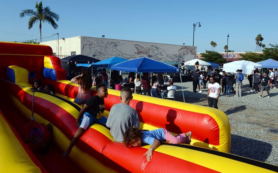 Kids play during Summer LuvinÕ Fest, at 5301 Long Beach Boulevard in North Long Beach Saturday. The free family friendly event featured multiple bands, as well as vendors, artists and the Long Beach local El Exclusivo food truck on site in Long Beach Saturday, September 1, 2018. .<br /> Photo by Stephen Carr / For The Long Beach Post