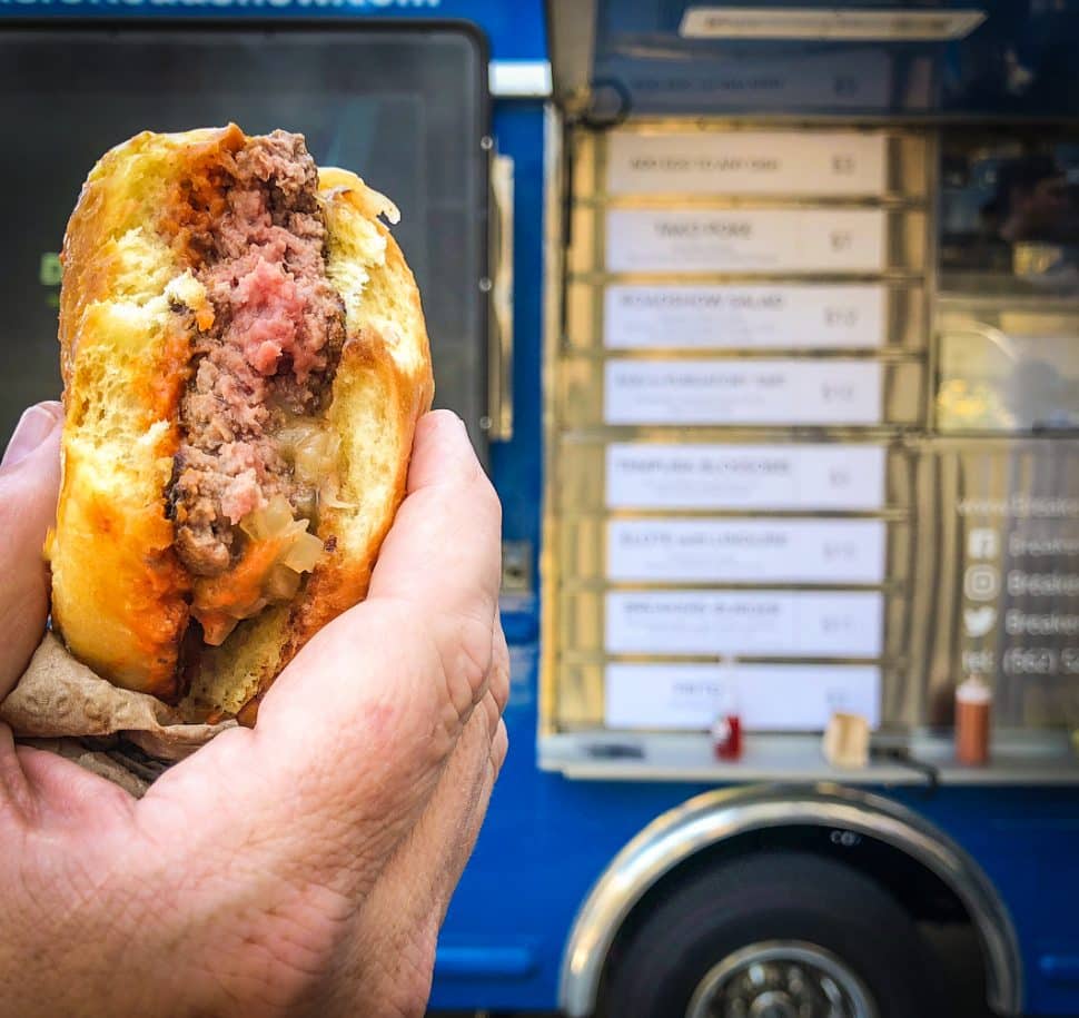 Chef David Coleman's Piedmontese beef burger with Grafton cheddar, remoulade, and onion jam. Courtesy of Breakers Roadshow.