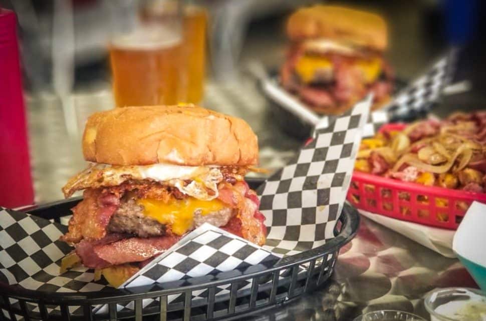 Hashtag Burger's concoction of beef, bacon, ham, cheese, and a fried egg. Courtesy of Jenn L./Yelp!