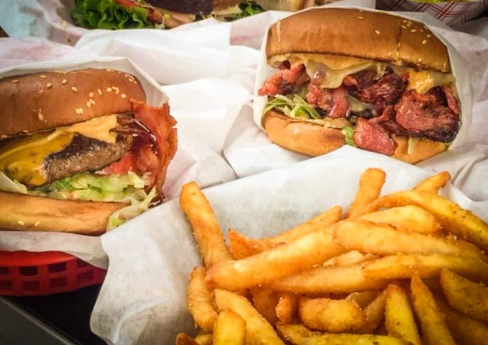 MVP's assortment of burgers with their cajun fries. Courtesy of RJ S./Yelp!