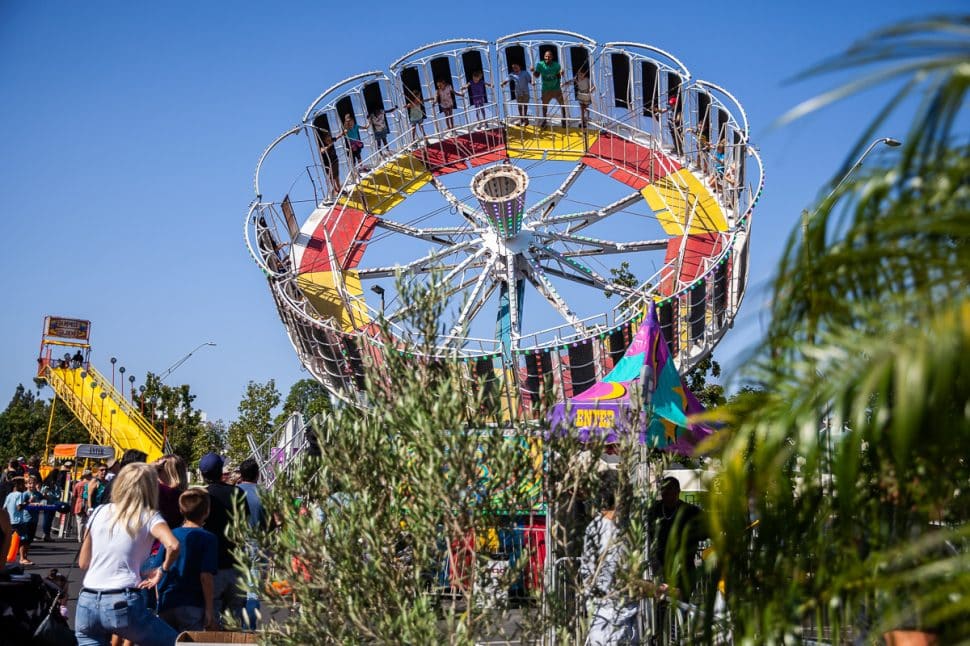Greek Festival visitors go spinning through the air on the "Round Up" thrill ride in Long Beach Sunday September 2, 2018. Photo by Kelly Smiley