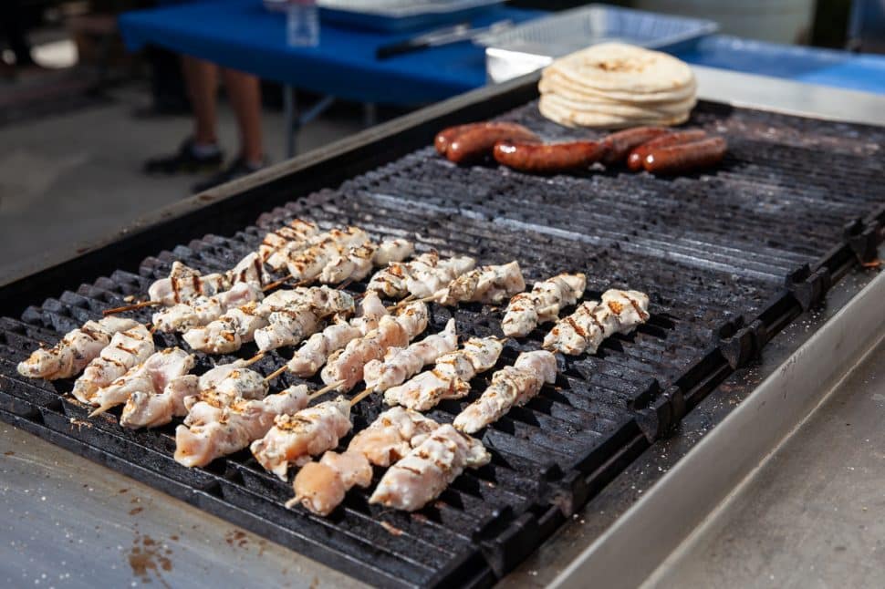 Chicken and Loukaniko cooks on the grill at the Greek Fest in Long Beach Sunday, September 2, 2018. Photo by Kelly Smiley