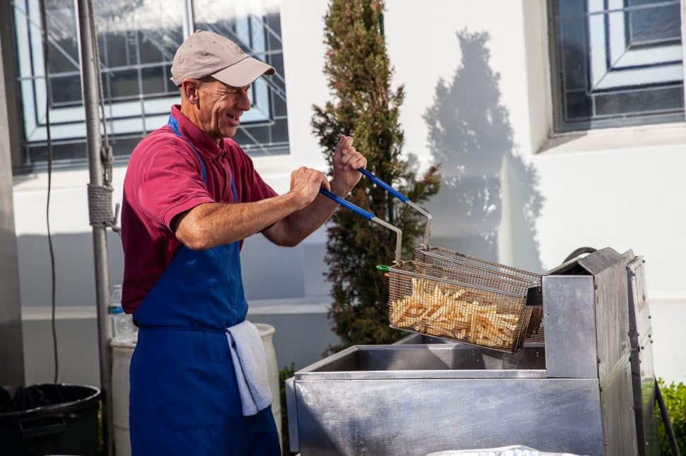 Bob Biggs shakes the fries at the Mezethes booth at the Greek Fest in Long Beach Sunday, September 2, 2018. Photo by Kelly Smiley