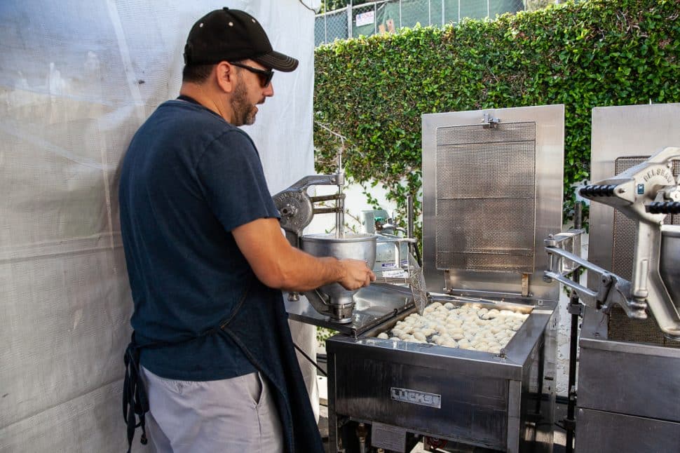 Preparing Loukoumades' Greek doughnuts in oil at the Greek Fest in Long Beach Sunday September 2, 2018. Photo by Kelly Smiley