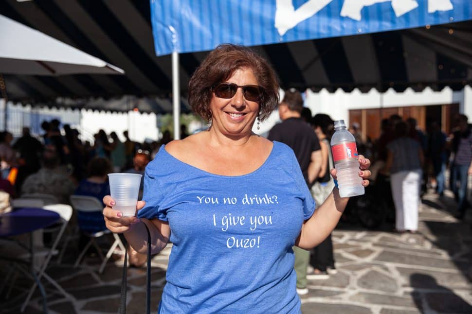 Ouzo is served as Cecelia Peters enjoys water at the Greek Fest in Long Beach Sunday September 2, 2018. Photo by Kelly Smiley