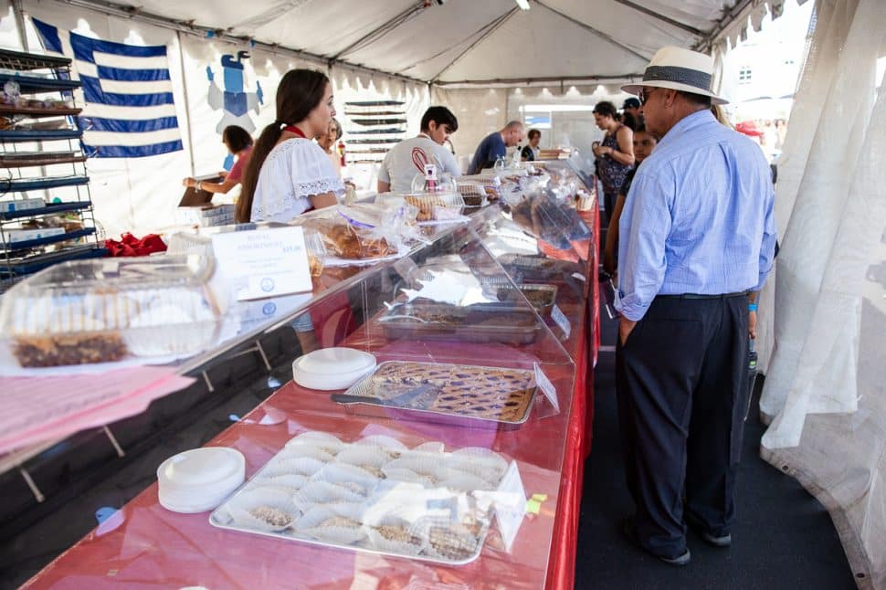 Greek Fest goers check out Vickie &amp; Jim Sullos' sweets and pastries booth in Long Beach Sunday September 2, 2018. Photo by Kelly Smiley