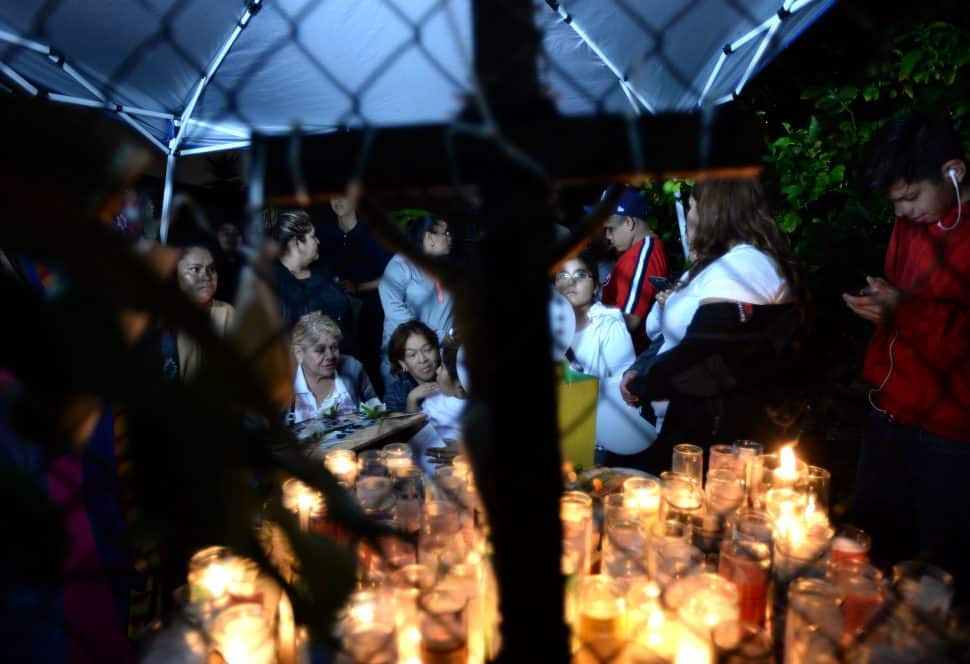 Friends and family at a vigil Friday evening, at the spot where 69-year-old Jose Raul Corrales was shot and killed Tuesday afternoon in a drive-by. Friday Oct 12, 2018. Photo by Stephen Carr.