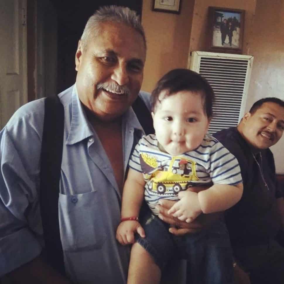 Jose Raul Corrales holds his great-grandson. Corrales was shot to death in West Long Beach on Oct. 9, 2018. Photo courtesy Jerry Amaya-Rodriguez.