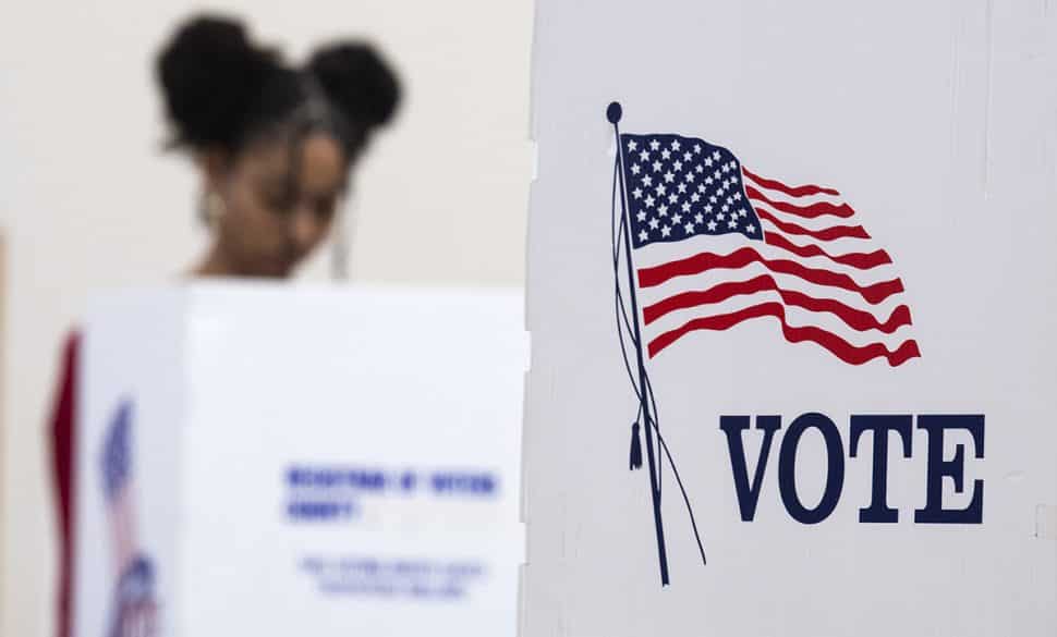 A woman does her part as she votes while her polling place in Long Beach November 6, 2018. Photo by Thomas R Cordova.