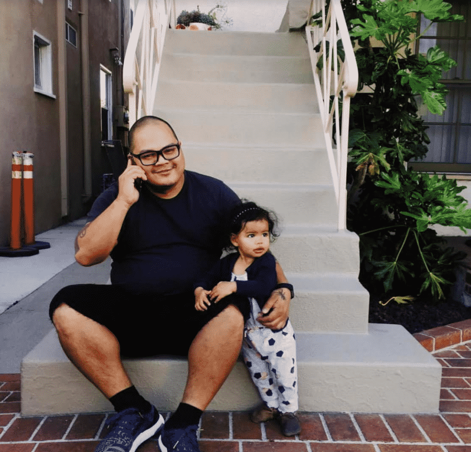 DJ Efechto [left] with Propaganda's youngest daughter. Courtesy of Propaganda.