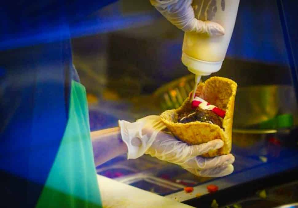 A falafel pita being assembled at Viva Falafel in Belmont Heights. Courtesy of Viva Falafel.