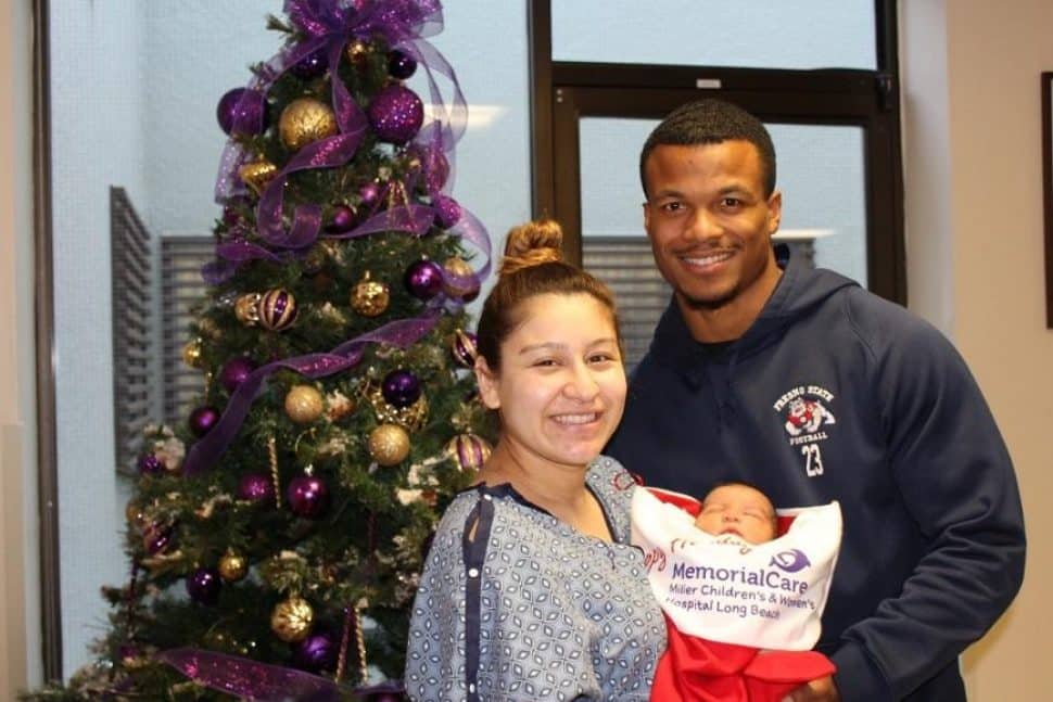 Alysa and Anthony Riggins prepare to bring 2-day-old Anthony Jeremiah home for Christmas with a giant, red stocking.